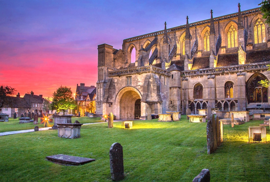 Sunset at Malmesbury Abbey, star of Malmesburys Fun Facts by Blount and Maslin